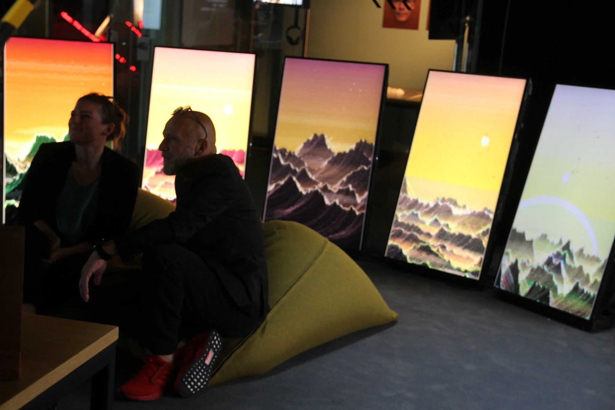 In Linz, five upright screens all playing Island, two visitors on a yellow beanbag