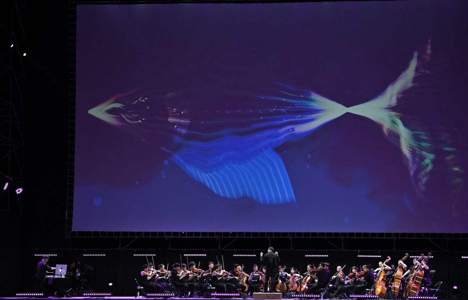 April Rain Fantasia, a SoulFish crossing the big screen above the orchestra and the console