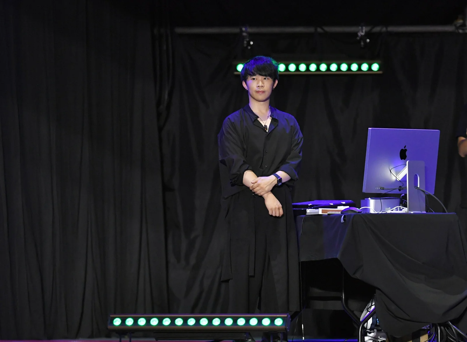 Che-Yu Wu beside his console on stage. Photograph: PTS