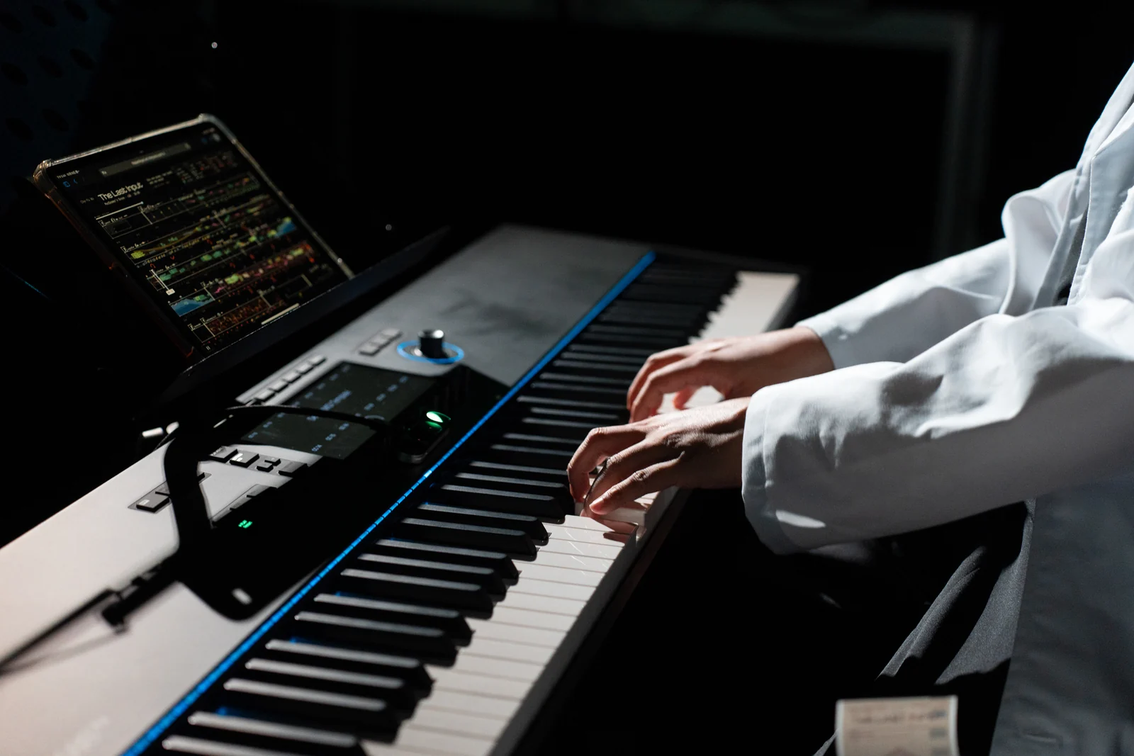 The Last Input rehearsal: hands on the keys, a graphic score on the tablet