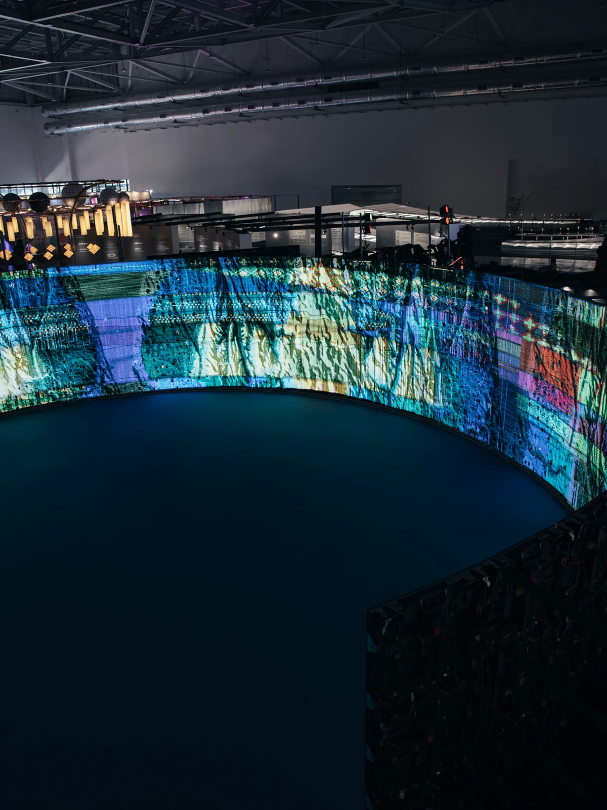 Woven Land, Woven River in the pavilion: From outside the ring, the loop of cloth under the pavilion roof