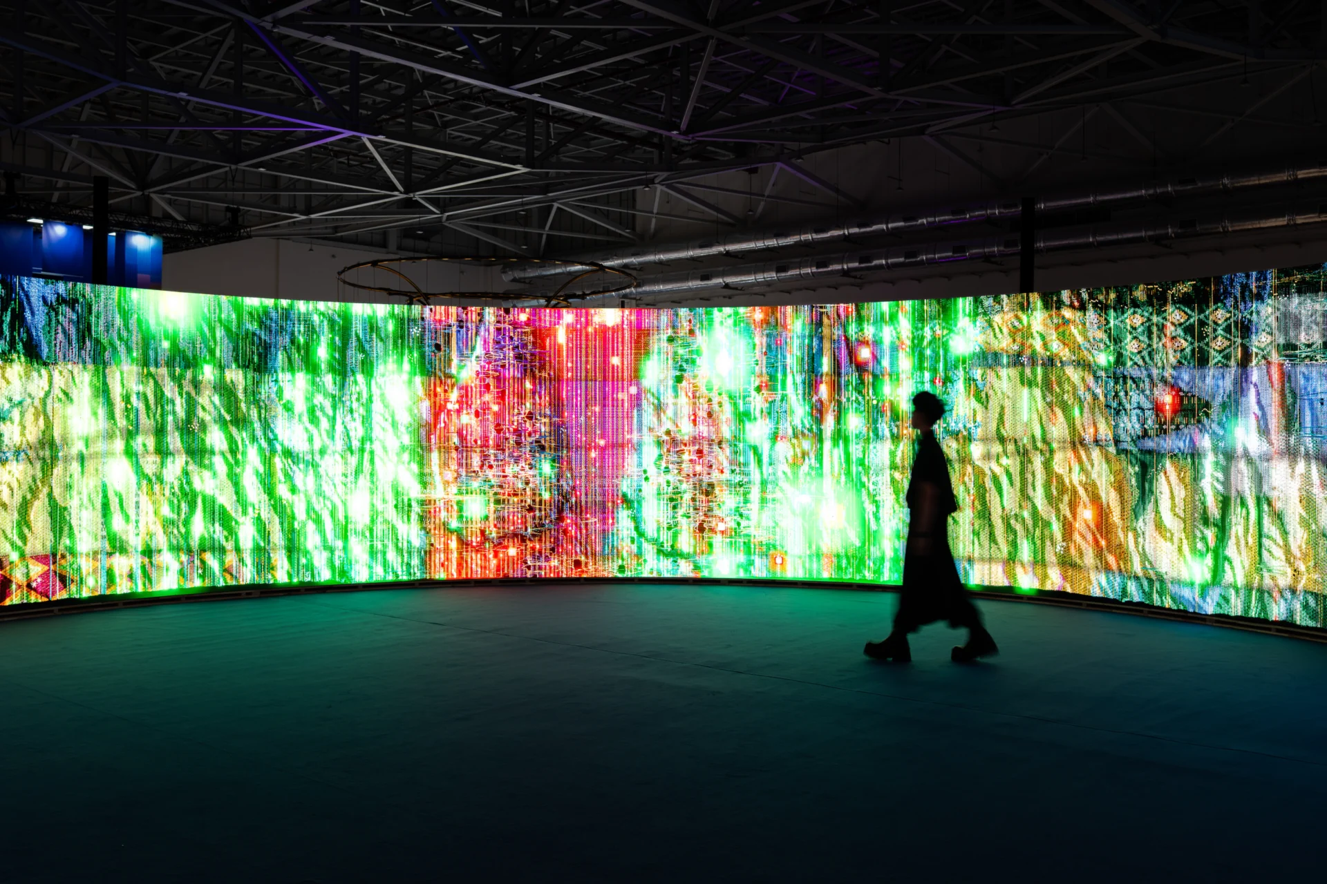 Woven Land, Woven River on site: A silhouette walking into the ring, the whole cloth alight