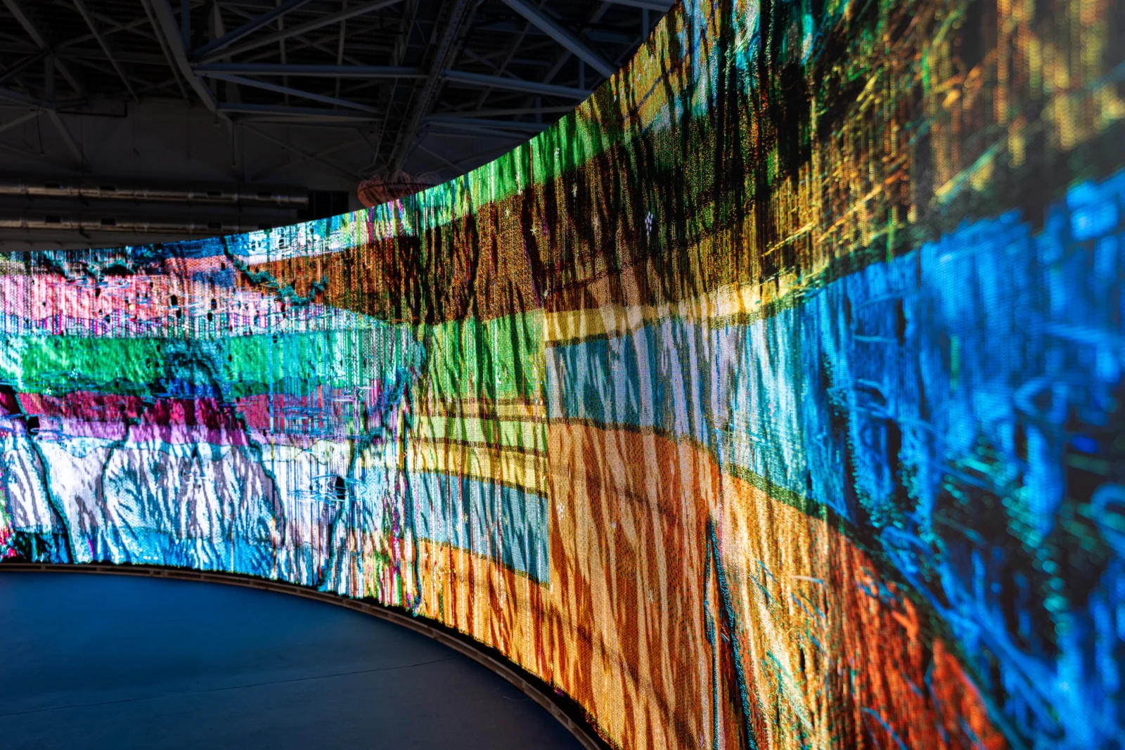 Woven Land, Woven River on site: Along the curve, bands of colour running into the distance