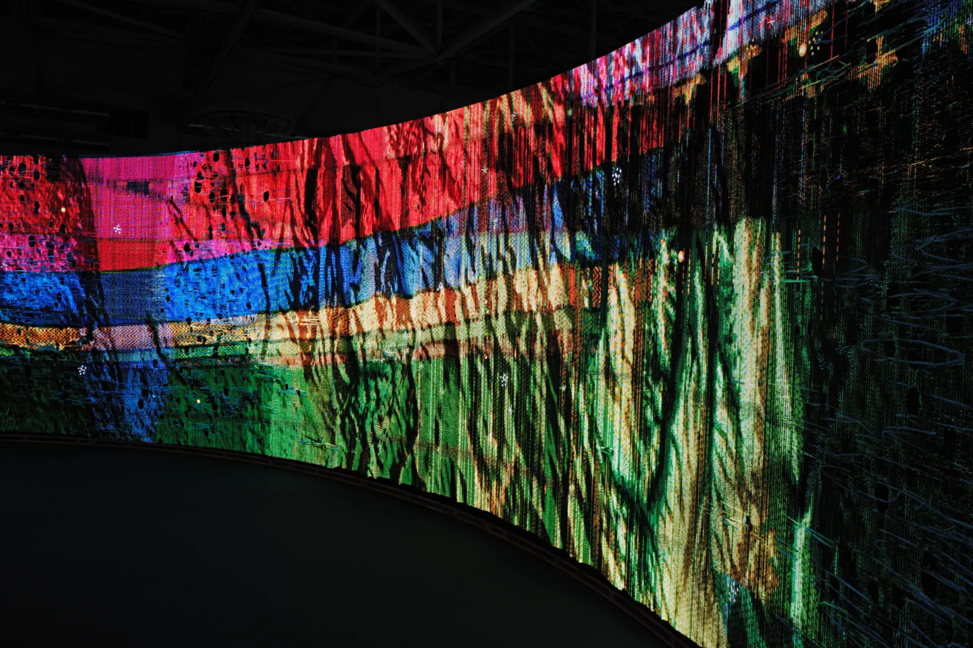 Woven Land, Woven River on site: Bands of red and blue crossing the cloth at a slant