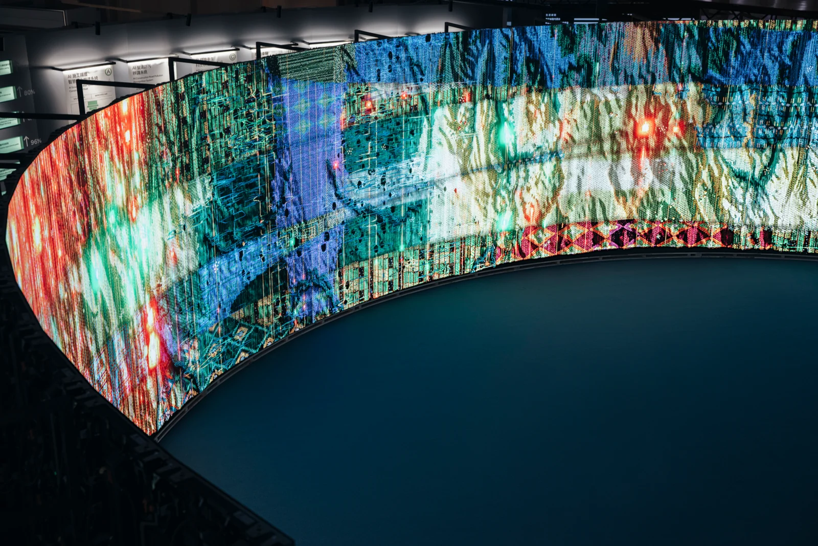 Woven Land, Woven River in the pavilion: One arc, woven from red into blue-green